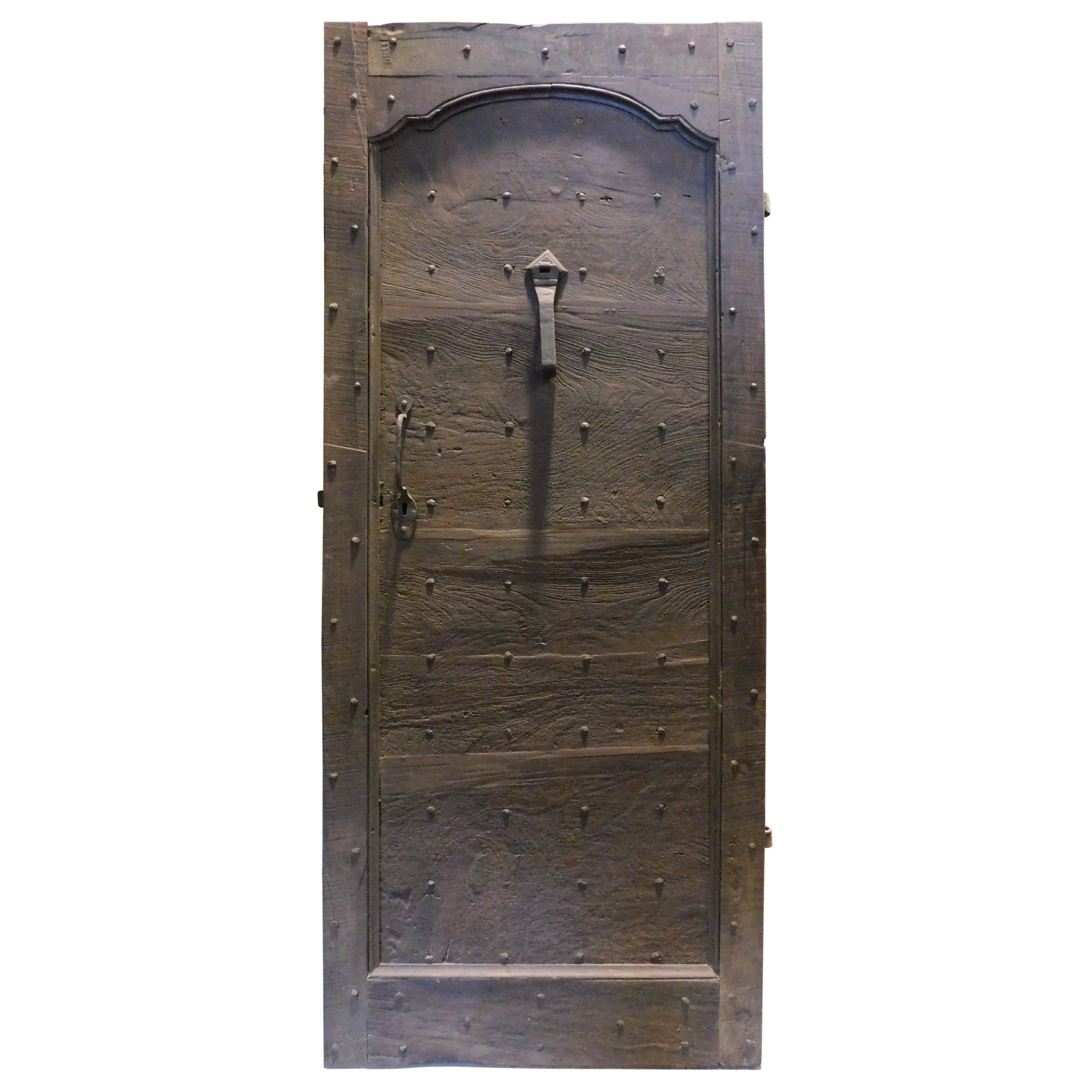 Antique walnut entrance door in rustic style, with nails, 18th century Italy
