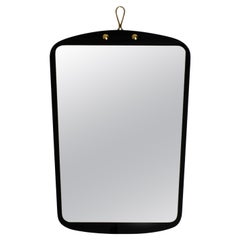 Large Mid Century Brass Wall Mirror with an Exceptional Black Glass Frame