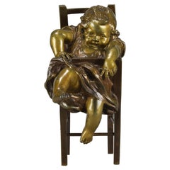 Spanische Bronze des frühen 20. Jahrhunderts mit dem Titel „Mädchen auf Stuhl“ von Juan Clara