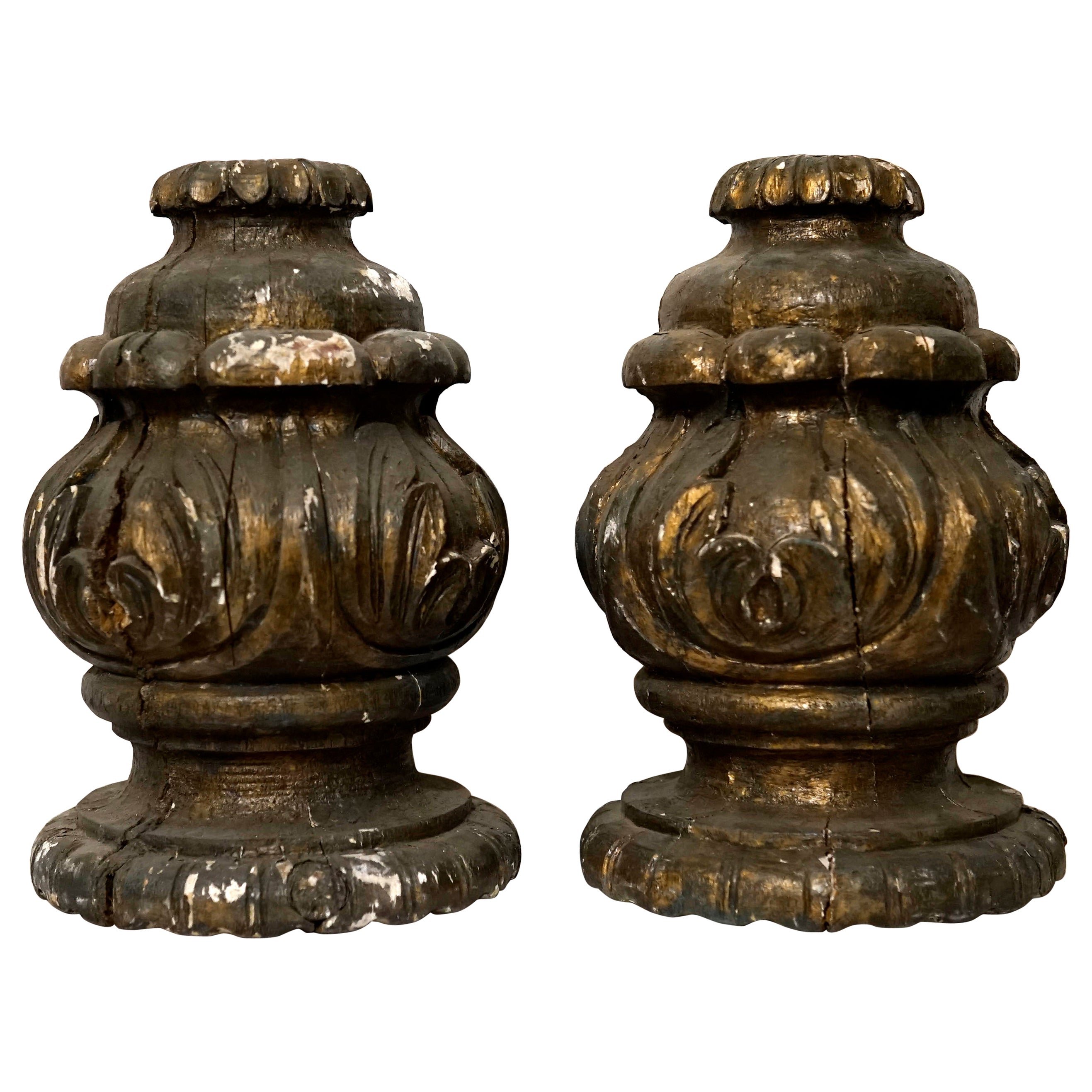 Italian details and beautiful acanthus hand carved leaves designed in an upward sweep make this pair of architectural finials stand out. These are circa mid to late 18th century giltwood pieces, each on a rounded foot. We believe these were part of