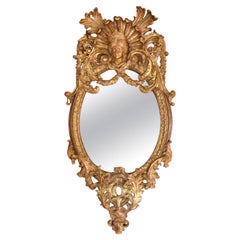 Miroir Rococo français avec cadre doré à tête de jeune fille ovale