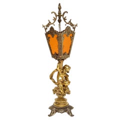Lampe chérubin française d'antiquités en métal doré et verre