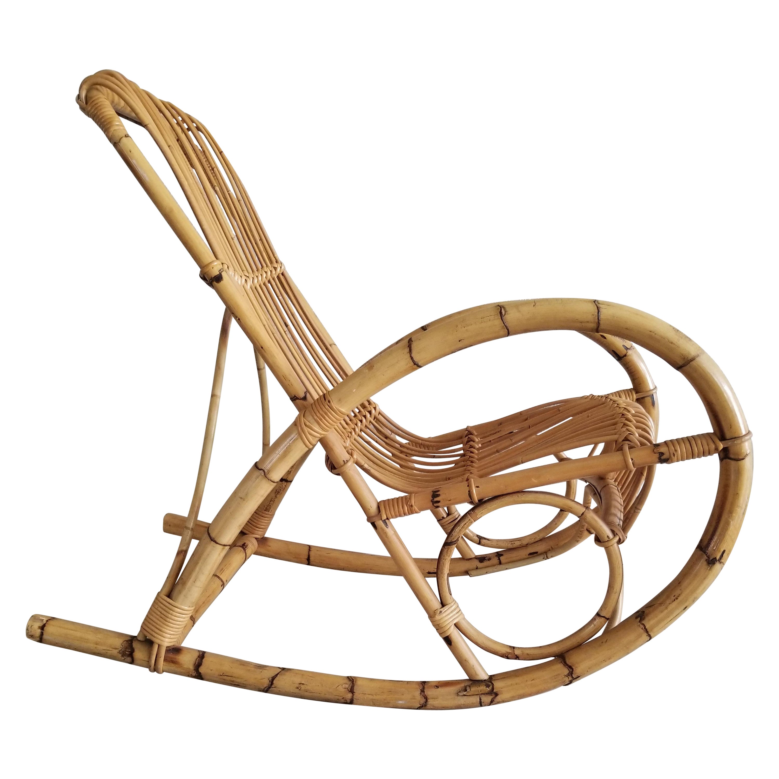 AMBIANIC presents
Italy 1960s relaxing Rocker 
Rocking Lounge Chair by Franco Albini designer architect.
Crafted in bentwood bamboo rattan.
Unmarked.
35 tall x 22 w x 41 d Seat h 17
Preowned original very good condition, unrestored unaltered.
Refer