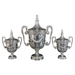 Suite of three Edwardian silver cups and covers