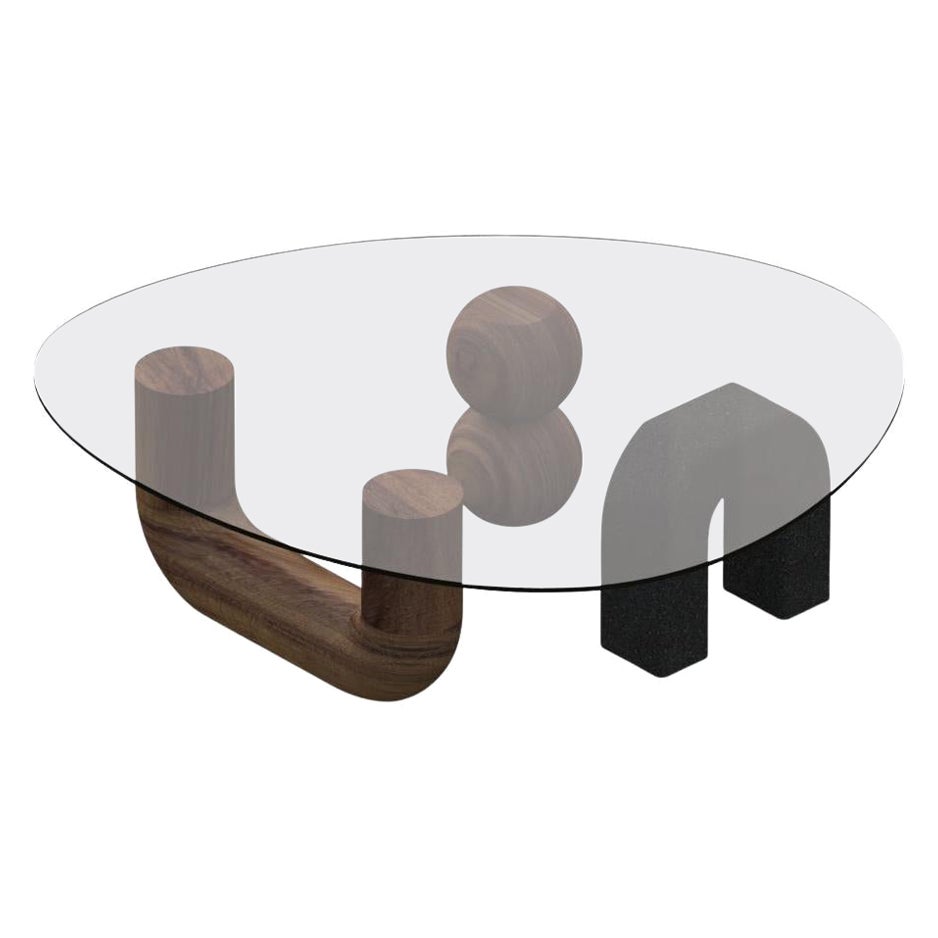 The Rosedal table is a sculptural coffee table assembled by three pieces. Two hand-shaped in Huanacaxtle solid wood and the other in volcanic stone; the top in clear glass lays down above, framing them.
*can be sold without the glass cover (only the