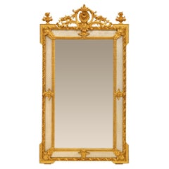 Miroir à double encadrement en bois doré Louis XVI du XIXe siècle