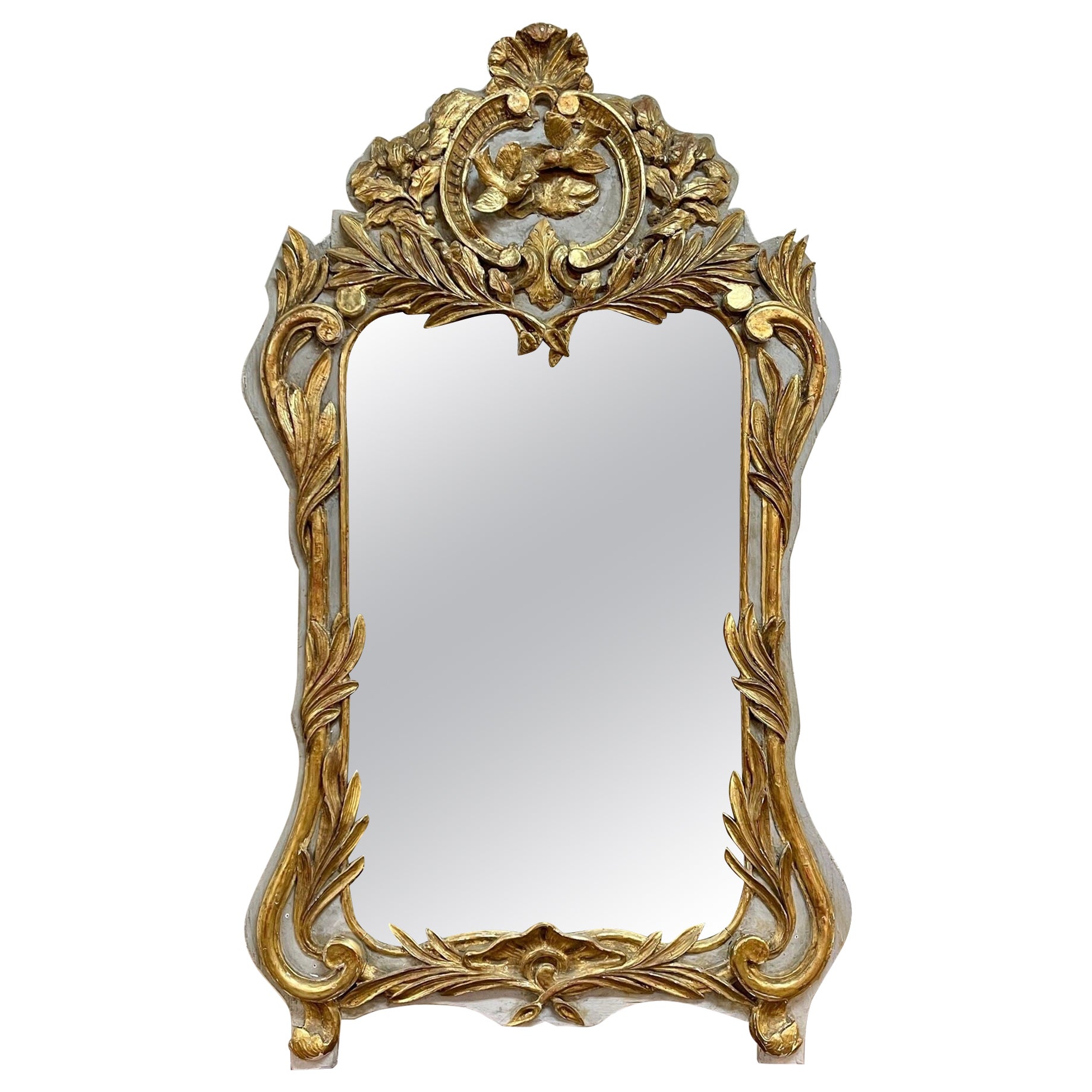 Miroir en bois sculpté et doré du début du XIXe siècle