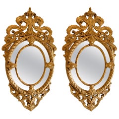 Retro French Pair of Hand-Carved Oval-Shaped Gilded Mirrors