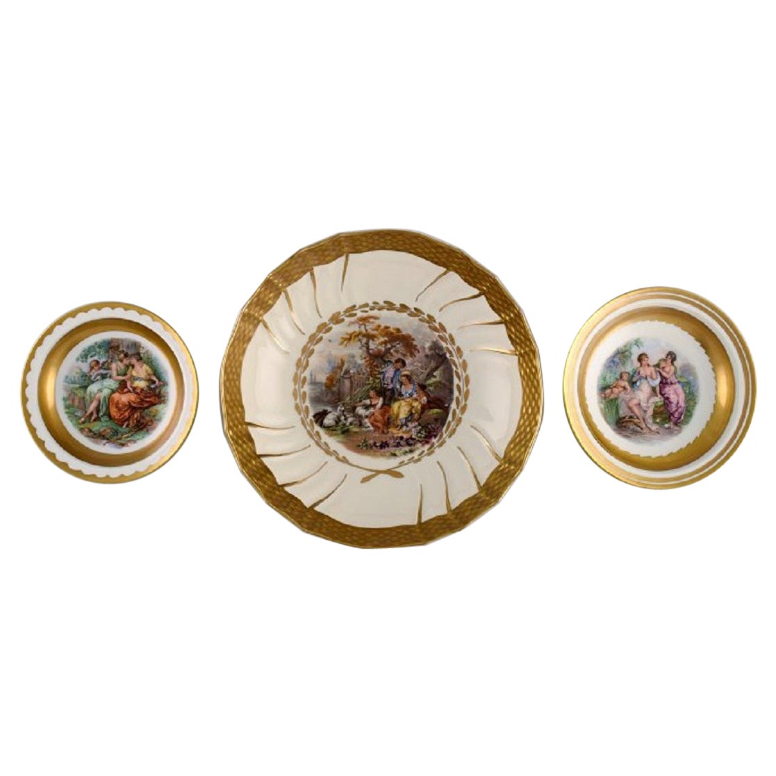 Three Royal Copenhagen bowls decorated with flowers and romantic scenery. 