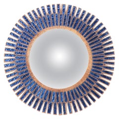 A blue talosel and resin convex mirror. Contemporary