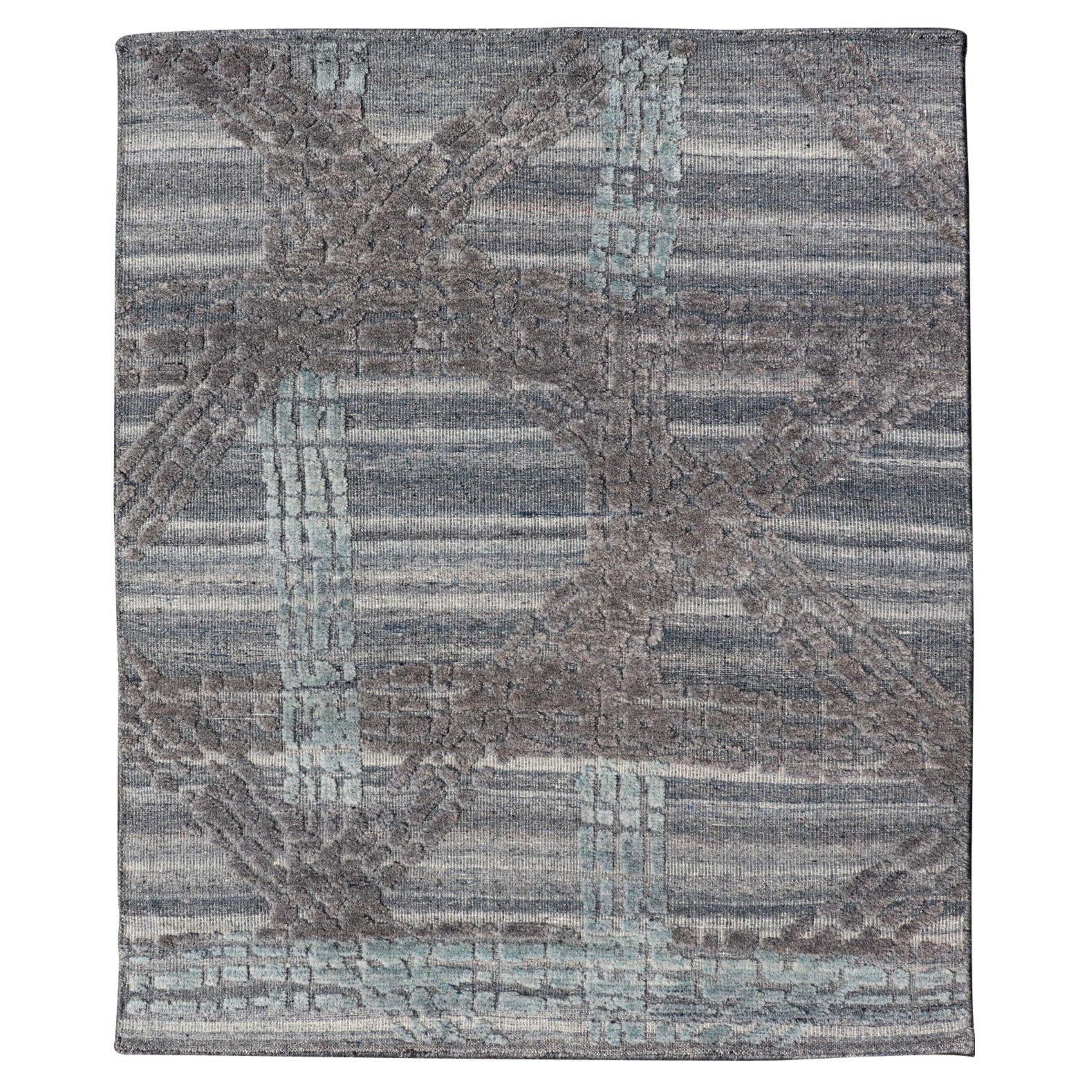 Moderner moderner abstrakter Teppich mit zeitgenössischem Design in Blau und Grau