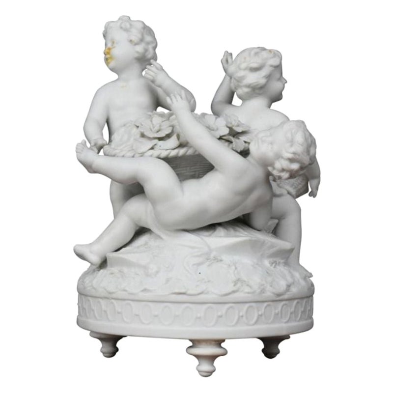 Group of Three Cherubs Around a Biscuit Basket, 1900 Period For Sale