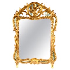A French carved and gilded wood mirror