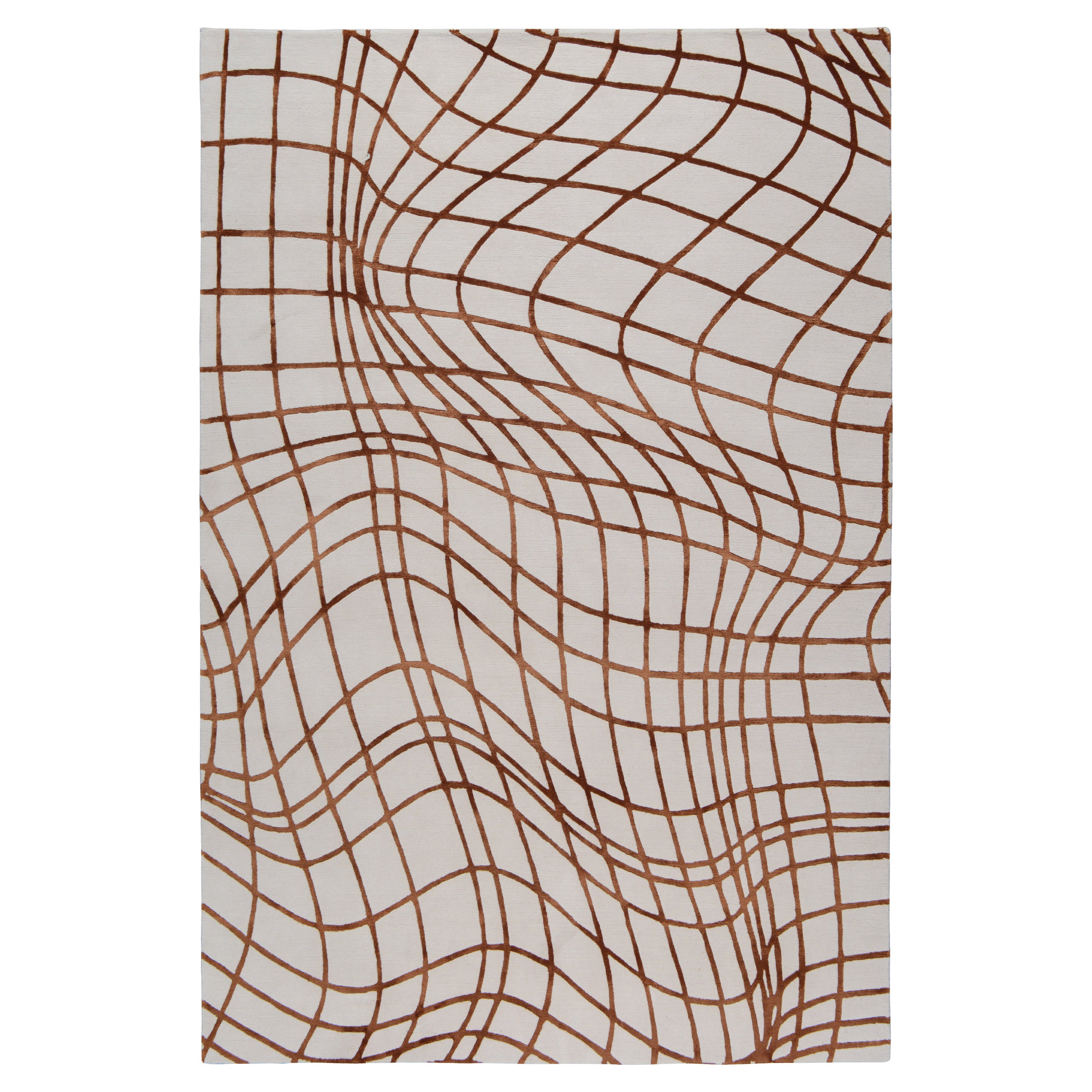 Wavelength features a distorted grid motif inspired by a 3D graph. The rug transforms the abstract lines into a bold motif, perfect for adding intrigue to a space. Woven by our expert craftspeople in Nepal using the finest wool and silk.