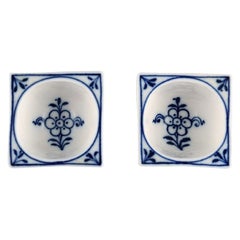 Two antique Meissen Blue Onion salt cellars in hand-painted porcelain.