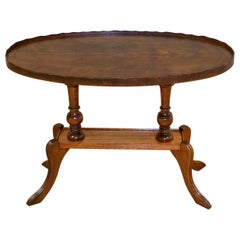 Vintage Regency Style Oval Yew Wood Pie Crust Edge Coffee Table on Sabre Feet