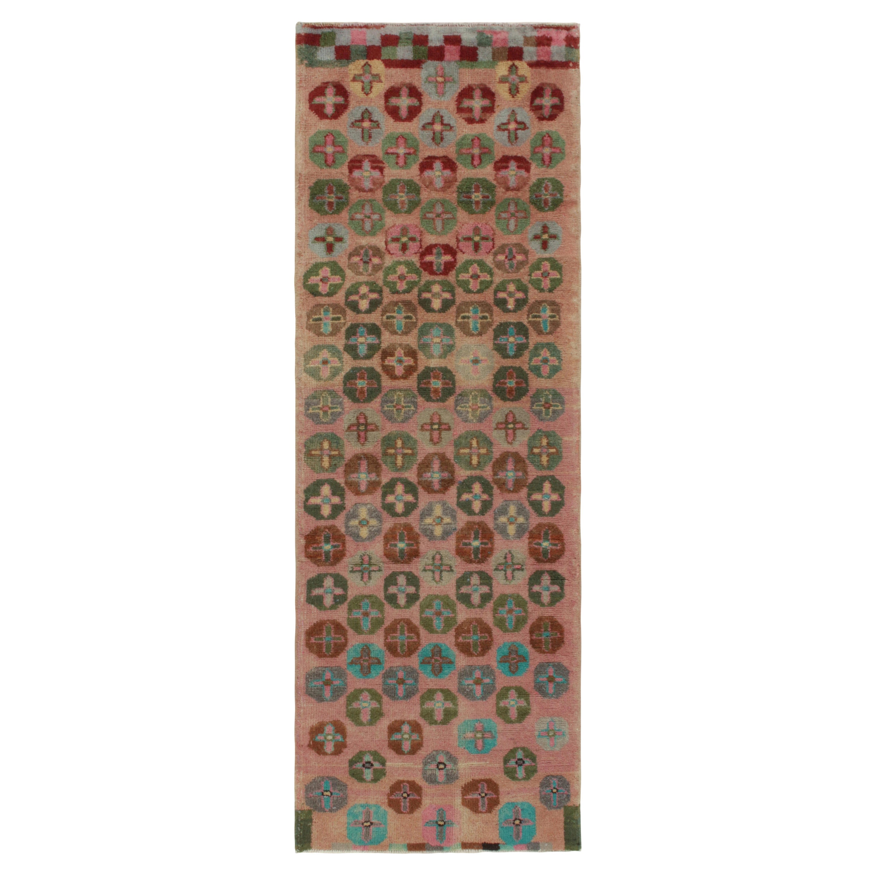 1960s Vintage Distressed Runner in Pink, Red Geometric Patterns by Rug & Kilim For Sale