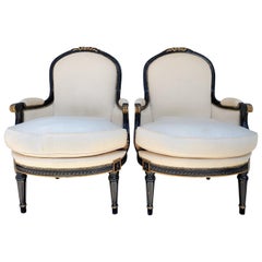 Late 19th Century Pair of French Black and Gilded Bergères Armchairs