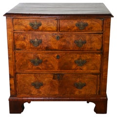A George II Walnut Chest of Drawers / Commode