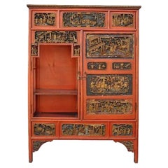 Antique Chinese Cabinet Lacquered in Coral Red and Carved, Late 19th Century