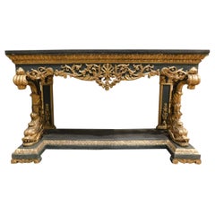 Vintage Gilded and lacquered console in richly carved wood, black marble top, Italy