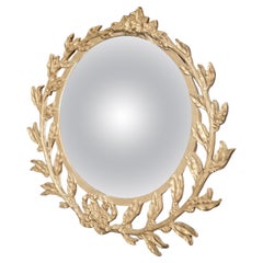 Miroir convexe doré avec détails en anneau de laurier
