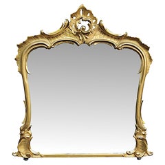 Superbe grand miroir surmonté d'un manteau en bois doré du 19ème siècle