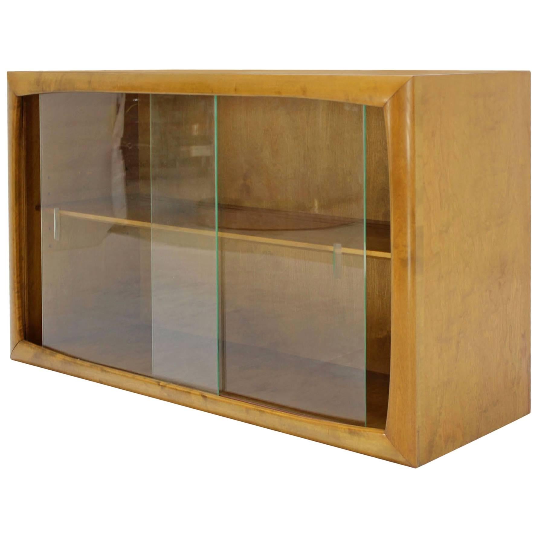 Edmund Spence Blonde Wood Swedish Modern Hanging Bookcase w/ Glass Sliding doors For Sale