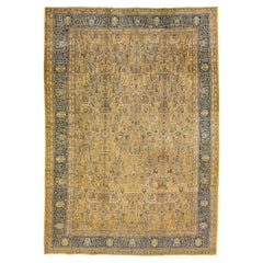 Tapis antique Tabriz jaune en laine persane à motifs floraux faits à la main