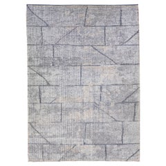 Tapis en laine gris moderne de style marocain fait à la main avec un design géométrique