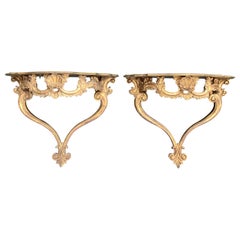 Paire de consoles rococo italiennes en bois doré