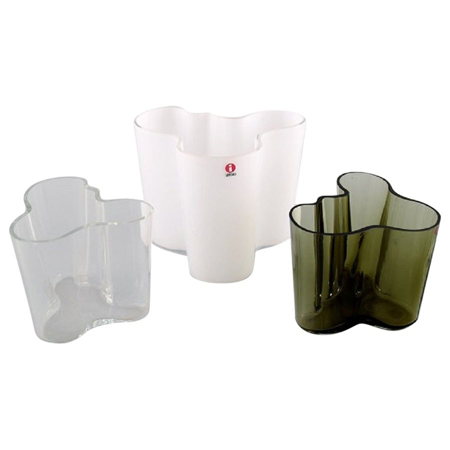 Alvar Aalto for Iittala. Three vases in green, white and clear art glass. 