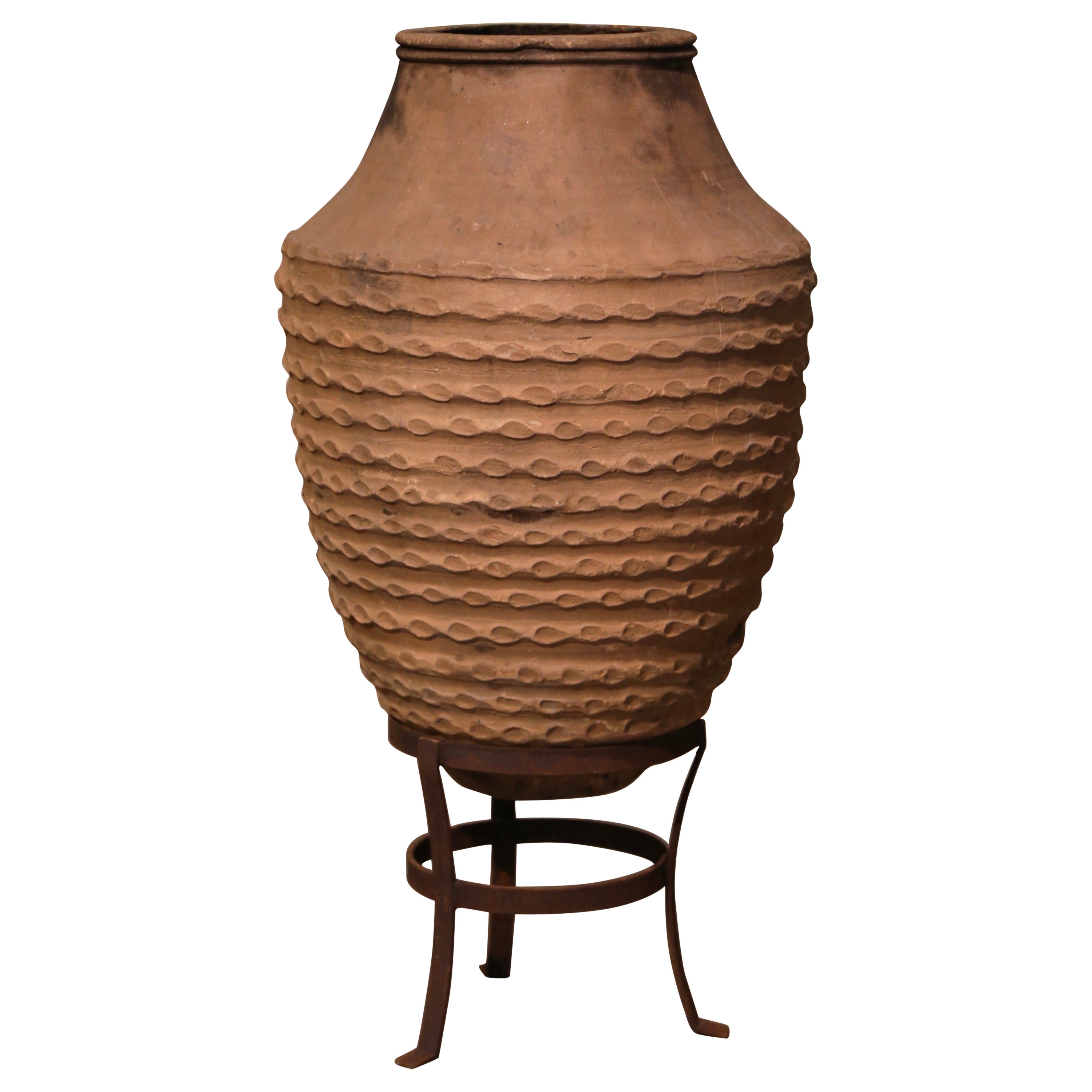 Early 20th Century Greek Fired Banded Terracotta Olive Jar with Iron Stand For Sale