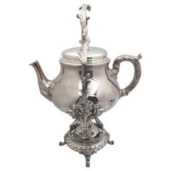 Tetera de plata Christofle con soporte de estilo rococó