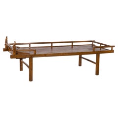 Qing Dynasty 19th Century Elm Daybed with Bamboo Seat and Guardian Lions