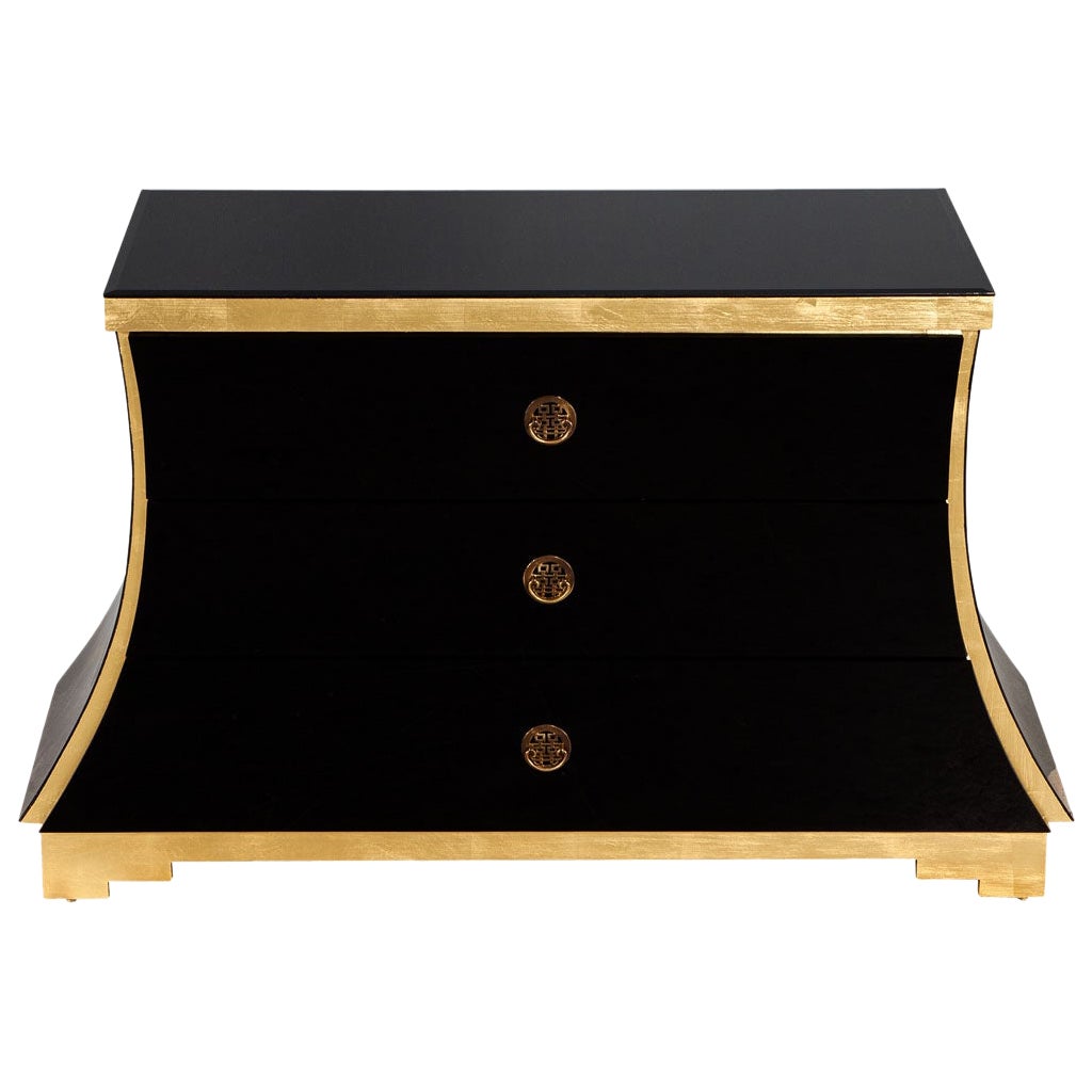 Hollywood Regency Black Glass and Gold Leaf Curved Commode For Sale