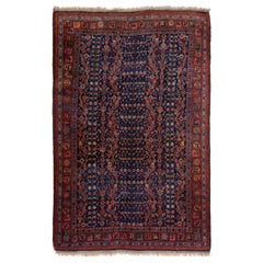 Ancien tapis persan Bidjar en laine bleue à motifs intégraux fait à la main