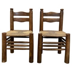 Pair of Mid-Century Brutalist Solid Wood and Rush Chairs by Charles Dudouyt