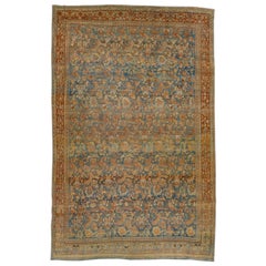 Tapis Bidjar ancien à fleurs surdimensionnées en laine bleue et rouille, fait à la main