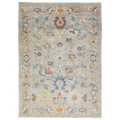 Alfombra moderna de lana azul con motivos florales hecha a mano en Sultanabad Rugs