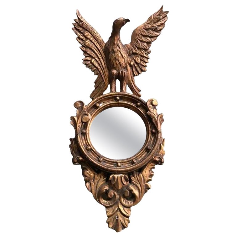 Miroir Empire en bois doré avec décoration d'aigle en vente