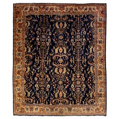 Antigua alfombra persa de lana Sarouk Farahan hecha a mano en azul oscuro con motivos florales