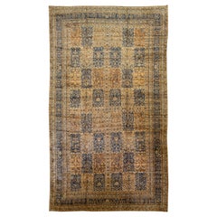 Ancien tapis Kerman en laine persane brun clair et bleu fait à la main avec motif sur toute sa surface