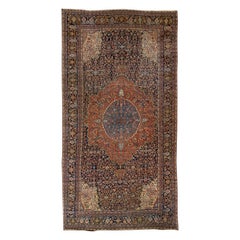 Ancien tapis Farahan en laine persane bleu et rouille fait à la main avec motif de rosette