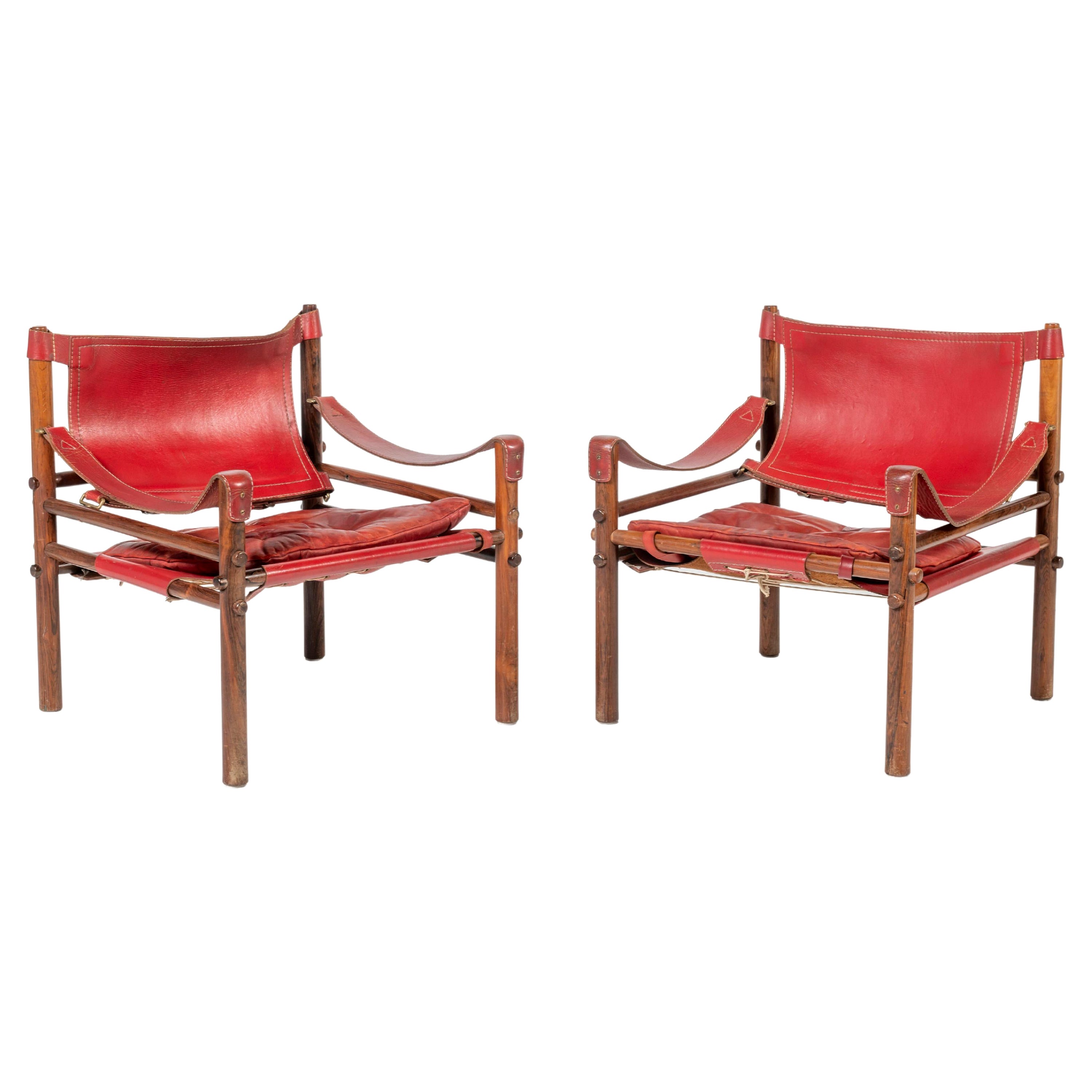 Arne Norell fauteuils Safari en cuir et bois rouge en vente