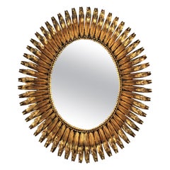 French Oval Sunburst Mirror in Gilt Wrought Iron, Eyelash Design, 1950s