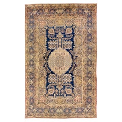 Tapis Kerman ancien en laine persane beige et bleu, fait à la main, avec motif sur toute sa surface