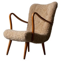 Carl Gustaf Hiort Af Ornäs, Lounge Chair, Wood, Sheepskin, Sweden, 1950s