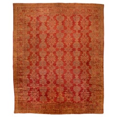 Ancien tapis turc Oushak en laine orange-ruste fait à la main avec motif géométrique