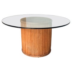 Boho Chic Glass Pedestal Dining Table with Split Pencil Reed Rattan Drum Base
